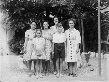 [Group portrait of four women and two children]