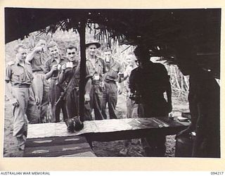 ULEBILUM, NEW GUINEA. 1945-07-13. CAPTAIN TAIT OF THE SALVATION ARMY RED SHIELD IN CONJUNCTION WITH THE AUSTRALIAN COMFORTS FUND, ESTABLISHED A COFFEE STALL IN THE A COMPANY, 2/5 INFANTRY BATTALION ..