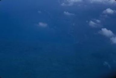 [Aerial view of forested hills on Espiritu Santo, Vanuatu]