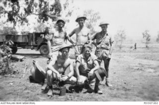 Ward's Airfield, Papua. 1942-12. Members of the electrical staff of No. 1 Operational Training Unit (OTU) RAAF at Ward Strip, near Port Moresby. Left to right: back row: Flight Sergeant R. B. ..