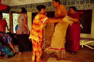 Matautia Ieriko niulevaea being dressed for title bestowal ceremony, Utufa'alalafa, Upolu, Samoa