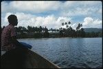 Man sitting on canoe