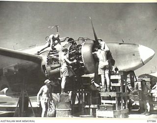 GROUND STAFF PERSONNEL OF NO. 30 SERVICING UNIT, ROYAL NEW ZEALAND AIR FORCE OVERHAULING LOCKHEED "VENTURA" PV1 MEDIUM BOMBER