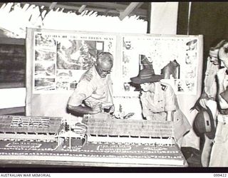 LAE, NEW GUINEA, 1945-12-03. BRIGADIER G. B. G. MAITLAND, DEPUTY DIRECTOR OF MEDICAL SERVICES, HEADQUARTERS FIRST ARMY AND MATRON G. E. M. BRINDLEY, 2/2ND GENERAL HOSPITAL, INSPECTING THE WINNING ..