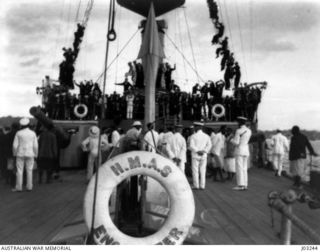 NATIVE CHIEFS OF THE REWA DISTRICT, ON BOARD H.M.A.S. "ENCOUNTER", PRESENTING QUANTITIES OF FRUIT FOR THE USE OF THE FLEET, AT SUVA IN 1914-11. (DONATED BY COMMANDER G.F. LANGFORD, R.A.N.)