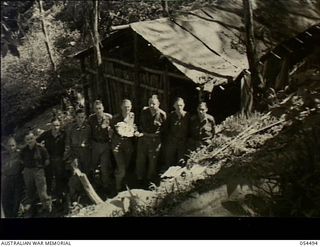Guadagasal, New Guinea. 1943-07-21. Officers at the Headquarters Camp of the 17th Australian Infantry Brigade, AIF. From the left they are, VX5460 Lieutenant W.P. Bolger, VX111097 Captain J.F. ..