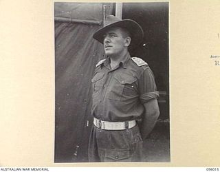 CAPE WOM, WEWAK AREA, NEW GUINEA. 1945-09-05. CAPTAIN J.F. MCWILLIAM, DEPUTY ASSISTANT PROVOST- MARSHAL, 6 DIVISION PROVOST COMPANY