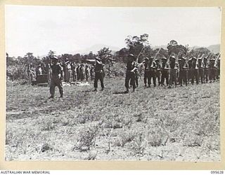 LAE AREA, NEW GUINEA. 1945-09-01. COLONEL J.T. SIMPSON, DEPUTY DIRECTOR OF ORDNANCE SERVICE, INSPECTED A PARADE OF THE ORDNANCE PERSONNEL UNDER HIS COMMAND IN THE LAE AREA, AT 4 ADVANCED ORDNANCE ..