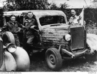 Wreck that saves lives. This battle scarred  ambulance built with galvanised iron and scrap material saved many lives in the battle for Wau.  It carried scores of men, some badly wounded from the ..