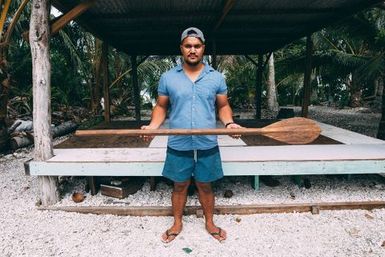 Co-collector Le Naponita Lepaio (Poni) holding a paddle, Atafu, Tokelau