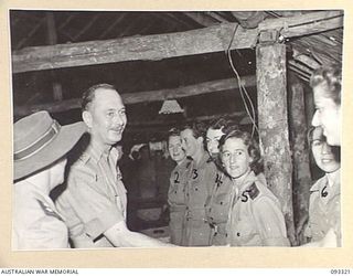 LAE AREA, NEW GUINEA, 1945-06-28. HIS ROYAL HIGHNESS, THE DUKE OF GLOUCESTER, GOVERNOR GENERAL OF AUSTRALIA (1) MEETING AUSTRALIAN ARMY NURSING SERVICE SISTERS AT 2/7 GENERAL HOSPITAL. THE GOVERNOR ..