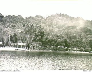 THE SOLOMON ISLANDS, 1945-10-13. GENERAL VIEW FROM OFFSHORE OF THE JAPANESE INTERNMENT CAMP ON MASAMASA ISLAND FOR NAVAL PERSONNEL. (RNZAF OFFICIAL PHOTOGRAPH.)