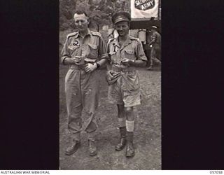 ROUNA, NEW GUINEA. 1943-09-18. SX27936 CAPTAIN H. V. CLARKE (LEFT), OFFICER COMMANDING "D" SECTION, 2/1ST AUSTRALIAN DENTAL UNIT AND SX2934 MAJOR D. M. W. SANDS, OFFICER COMMANDING, 85TH AUSTRALIAN ..