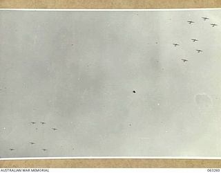 KILIGIA, NEW GUINEA. 1944-01-01. FORMATION OF HEAVY BOMBERS OF THE 5TH UNITED STATES AIR FORCE FLYING OVER THE AREA ON THEIR WAY TO BOMB JAPANESE POSITIONS