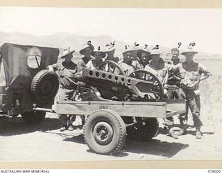 GUNNERS OF THE 2ND MOUNTAIN BATTERY DEMONSTRATING THE EASE WITH WHICH THEIR 75MM GUN CAN BE DISMANTLED FOR TRANSPORT. IDENTIFIED PERSONNEL ARE: BOMBARDIER G. HULL (1); BOMBARDIER J. CROWE (2); ..