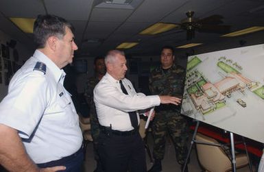 U.S. Air Force (USAF) GEN. Paul Hester (left), Commander Pacific Air Forces (PACAF), is given a briefing by an unidentified civilian official from the 15th Civil Engineer Squadron, Hickam Air Force Base, Hawaii, about Hickam's fire department abilities and facilities during his introductory tour of the base on Dec. 15, 2004. (PHOTO by Michael Day, CIV) (Released)