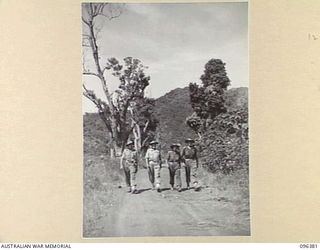 RABAUL, NEW BRITAIN, 1945-09-10. OFFICERS FROM 5 BASE SUB-AREA LOOKING FOR A FUTURE CAMP SITE. AN AUSTRALIAN FORCE DRAWN FROM 4 INFANTRY BRIGADE OCCUPIED THE RABAUL AREA FOLLOWING THE SURRENDER OF ..