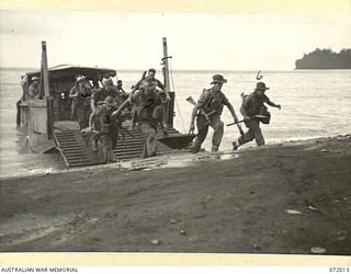 KILIGIA, PAPUA, NEW GUINEA. 1944-04-03. TROOPS OF THE 101ST BRIGADE SUPPORT COMPANY, HEADQUARTERS 5TH DIVISION, ENGAGED IN A PRACTICE BEACH LANDING FROM A LANDING CRAFT MECHANIZED TO ESTABLISH A ..