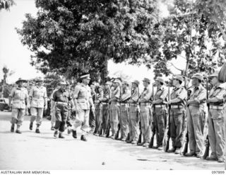 RABAUL, NEW BRITAIN. 1945-10-10. A SPECIAL PARADE AND CONCERT WAS HELD AT THE CHINESE ARMY CAMP TO CELEBRATE THE 34TH ANNIVERSARY OF THE FOUNDING OF THE CHINESE REPUBLIC. SHOWN, MAJOR GENERAL K.W. ..