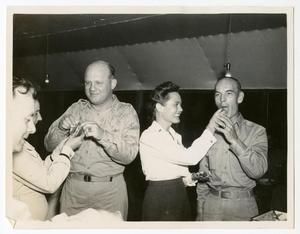 [Chief Nurse Lucy Wilson Feeding Serviceman Cake]