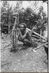 Pig festival, wig ritual, Tsembaga: man makes frame for elevated oven in which food for wig men will be cooked
