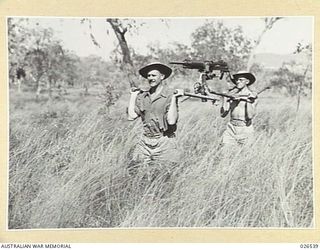PAPUA, NEW GUINEA. 1942-09-07. A 7.7 MILLIMETRE JAPANESE MACHINE GUN CAPTURED AT MILNE BAY. IT WEIGHS APPROXIMATELY 130 POUNDS AND IS CARRIED BY MEANS OF POLES BY TWO OR THREE MEN. IT IS AIR COOLED ..