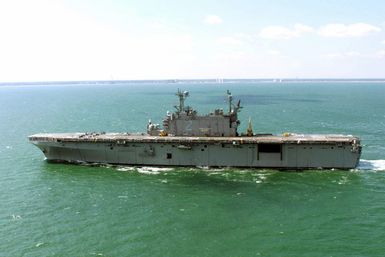 Port side view of the US Navy (USN) TARAWA CLASS: Amphibious Assault Ship USS SAIPAN (LHA 2) underway off the coast of Virginia Beach, Virginia (VA)