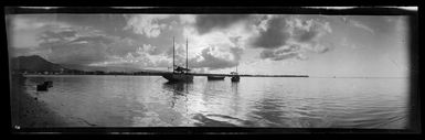 View in Samoa [probably near Apia], showing boats moored in a bay