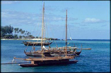Three boats with long masts