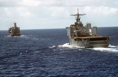 The dock landing ship USS GERMANTOWN (LSD-42) approaches the fleet oiler USNS ANDREW J. HIGGINS (T-AO-190) for an underway replenishment in the waters off Saipan during Operation Tandem Thrust