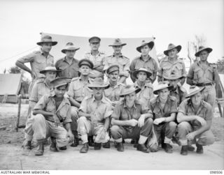 A group of Australian New Guinea Administrative Unit personnel. An Australian New Guinea Administrative Unit Administrative Headquarters is being set up at Kavieng with Captain F N W Shand, ..