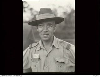 VIVIGANI, GOODENOUGH ISLAND, PAPUA NEW GUINEA. 1943-09-26. INFORMAL PORTRAIT OF PILOT OFFICER ARTHUR GREEN OF LOCKLEY, SA, A MEMBER OF NO. 7 MOBILE WORKS SQUADRON RAAF