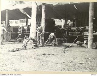 MADANG, NEW GUINEA. 1944-12-14. A "MATILDA" TANK TRACK BEING REPAIRED IN THE WORKSHOPS OF THE 2/4TH ARMOURED REGIMENT