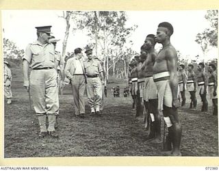 BISIATABU, NEW GUINEA. 1944-04-19. MAJOR GENERAL B.M. MORRIS, DSO, GENERAL OFFICER COMMANDING, AUSTRALIAN NEW GUINEA ADMINISTRATIVE UNIT (1), ACCOMPANIED BY THE HONOURABLE E.J. WARD, MINISTER FOR ..