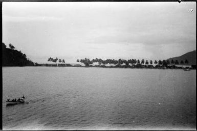 View of Salamaua from the sea with a boat in the foreground, Salamaua, New Guinea, 1933 / Sarah Chinnery