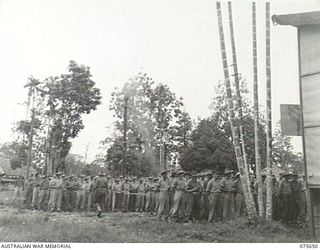 LAE, NEW GUINEA. 1944-09-03. PERSONNEL OF HEADQUARTERS, NEW GUINEA FORCE ATTENDING A SERVICE TO COMMEMORATE THE 5TH ANNIVERSARY OF THE OUTBREAK OF WAR CONDUCTED BY NX156703 CHAPLAIN R.S. PICKUP, ..