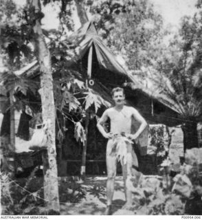 INLAND FROM PORT MORESBY, NEW GUINEA. 1943-11. UNIT NO 1 WIRELESS UNIT RAAF. JAPANESE KANA WIRELESS INTERCEPT OPERATORS' CAMP SITE SHOWING LEADING AIRCRAFTMAN CHAS MCCOLL "BACK TO NATURE". (DONOR ..