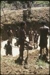 Fish pond being excavated by hand, to be stocked by government with tilapia as source of protein for local diet