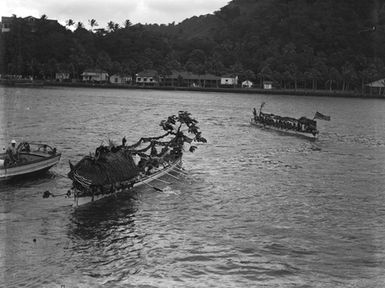 [Pacific island view with canoes]