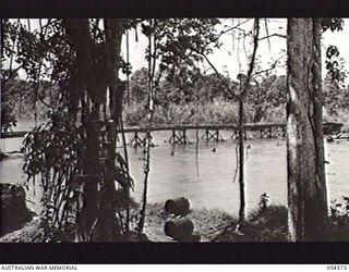 LOPUTA, NEW GUINEA, 1943-07-20. AMERICAN BUILT BRIDGE OVER THE GERUA RIVER. THIS BRIDGE WAS BUILT BY "C" COMPANY, 116TH ENGINEERS, 41ST DIVISION, UNITED STATES ARMY