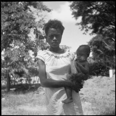 Woman holding a baby on her hip, New Guinea, ca. 1936, 3 / Sarah Chinnery