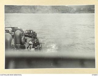 WIDE BAY, NEW BRITAIN. 1944-11-04. RAN VESSELS BOMBARDING JAPANESE POSITIONS WITH SECONDARY ARMAMENT