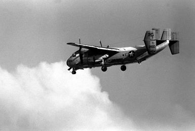 A Fleet Logistic Support Squadron 50 (VRC-50) C-2A Greyhound aircraft passes over part of the station while conducting touch-and-go landing operations