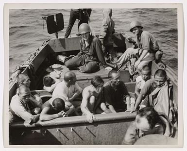 Photograph of Japanese Prisoners Aboard Landing Barge with Coast Guardsmen