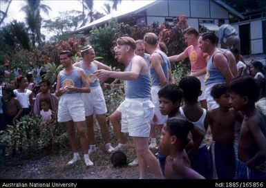 Men in sporting uniforms in garden