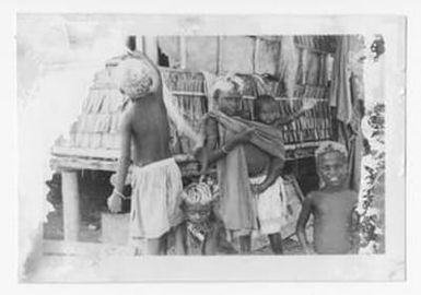 [Five Bougainvillean Children In Front Of Hut]