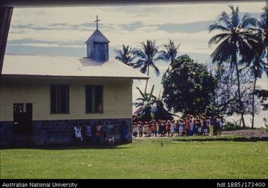 New church on site just inland of old Father Meyer church with sea shore in background. Site 8 is behind church