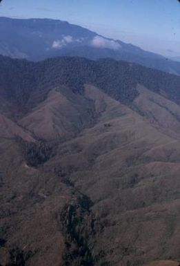 [Aerial view of forested mountains in Papua New Guinea]