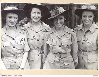 BRISBANE, QLD. 1945-02-21. AUSTRALIAN ARMY MEDICAL WOMEN'S SERVICE REINFORCEMENTS AT FRAZER'S PADDOCK BEFORE THEIR EMBARKATION TO THE 2/1 GENERAL HOSPITAL AT BOUGAINVILLE. IDENTIFIED PERSONNEL ..