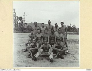 TOROKINA, BOUGAINVILLE ISLAND. 1945-01-13. THE HOCKEY TEAM OF HEADQUARTERS, 2ND AUSTRALIAN CORPS WHICH PLAYED A TEAM FROM THE ROYAL NEW ZEALAND AIR FORCE ON THE PIVA AIRSTRIP